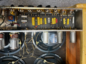 Interior view of a 1957 Fender Bassman 5F6 Narrow Panel 40-Watt 4x10" Guitar Combo shows its electronic components, wiring, and four speakers—highlighting the iconic vintage design by Fender.