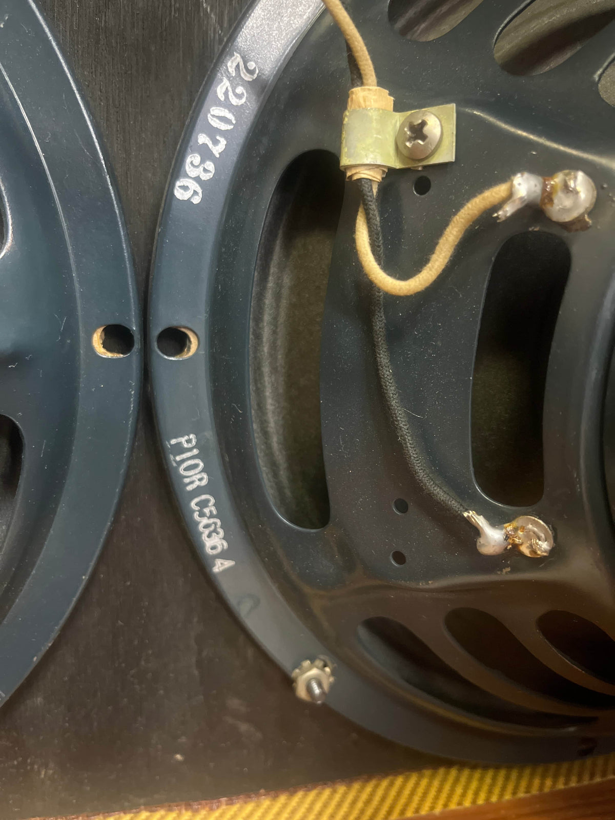 Close-up of the back of a Fender 1957 Bassman 5F6 Narrow Panel 40-Watt 4x10" Guitar Combo, showing wiring, screws, and stamped numbers "220336" and "P10R C5834"—classic details on this vintage Fender amp.