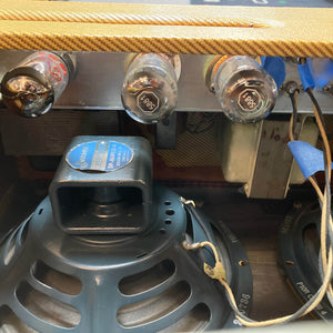 Close-up view of the interior of a 1957 Fender Bassman 5F6 Narrow Panel 40-Watt 4x10" Guitar Combo w/Flight Case, showing vacuum tubes, speaker, transformer, and wiring components. Brand: Fender.