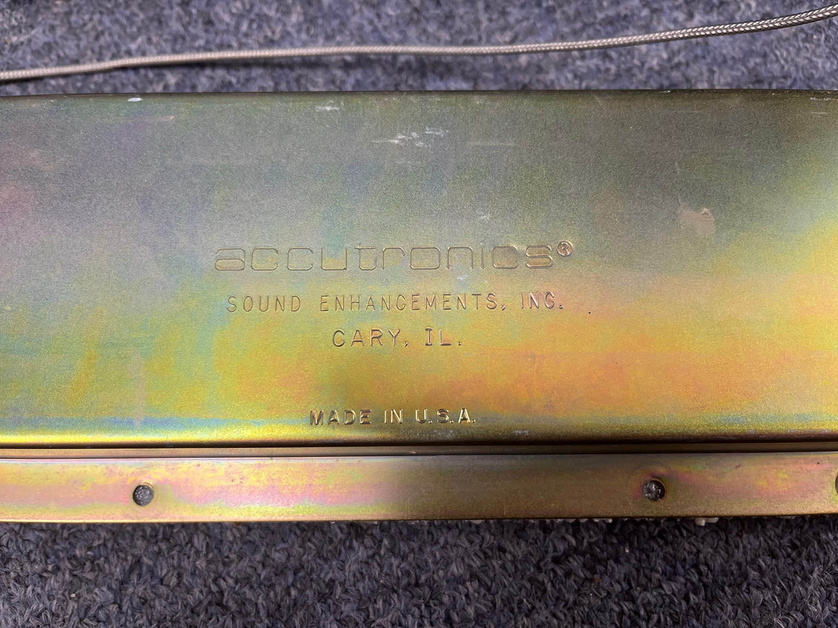 Metallic surface stamped with "Accutronics® Sound Enhancements, Inc., Cary, IL. Made in USA" against textured background—classic spring reverb as found in the 1966 Fender Black Panel Twin Reverb 2-Channel 85-Watt 2x12" Amp.
