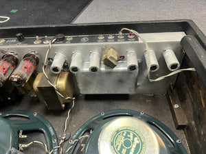 The image shows the interior of a 1966 Fender Twin Reverb 2-Channel 85-Watt 2x12" Guitar Combo Amp by Fender, featuring vacuum tubes, transformers, wiring, green speakers, and components of its classic spring reverb system.