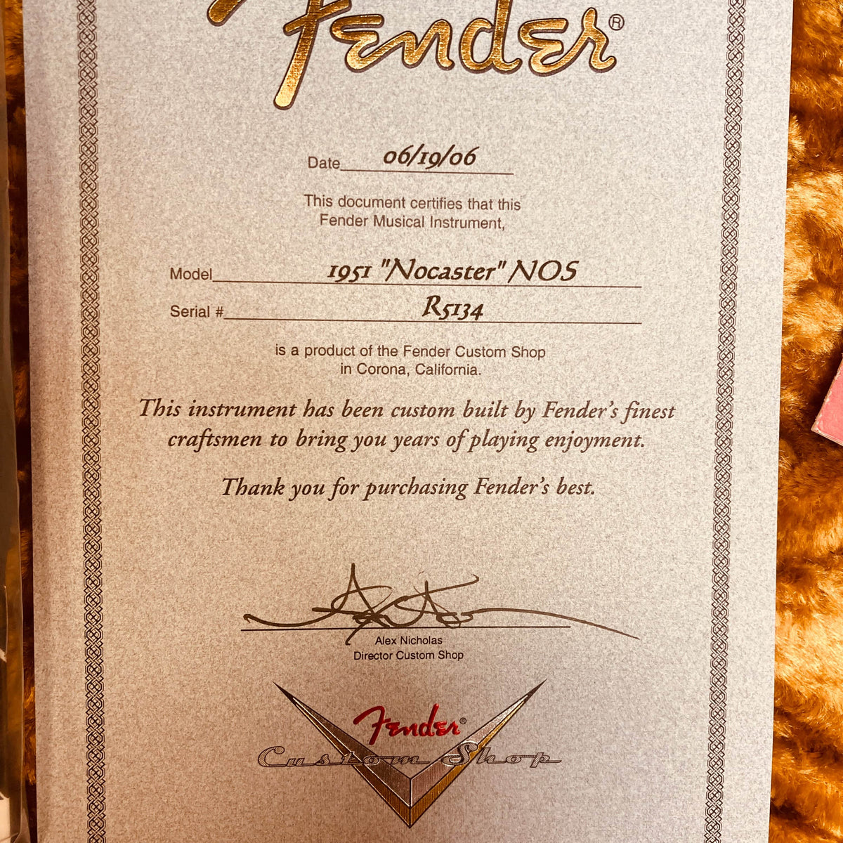 A certificate from Fender dated 06/19/06 certifies the Fender Custom Shop '51 Reissue Nocaster NOS 2006, signed by Alex Nicholas, Director of the Fender Custom Shop.