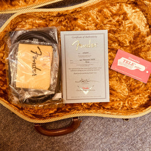 Includes a Fender certificate of authenticity, cable, pouch, and red “Genuine Tele Guitar” card in a gold velvet-lined case—ideal for your Fender Custom Shop ’51 Reissue Nocaster NOS 2006.