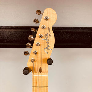 Close-up of the Fender Custom Shop '51 Reissue Nocaster NOS 2006 headstock, highlighting its tuning pegs, string guides, and Fender logo against a neutral background.