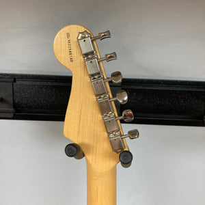 Fender Deluxe Powerhouse Stratocaster guitar neck with metal pegs and pickups, highlighting its craftsmanship and design for premium sound quality.
