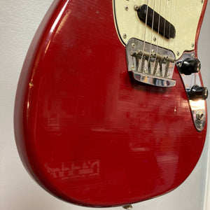 Close-up of a Fender Duo-Sonic II Dakota Red 1966 Vintage electric guitar, showing dual pickups and minor finish blemishes.