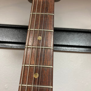 Close-up of a 1966 Fender Duo-Sonic II guitar neck, showcasing vintage details and minor blemishes.