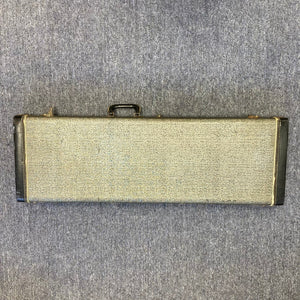 Fender Duo-Sonic II Dakota Red 1966 Vintage guitar with visible blemishes, resting in its case on concrete floor.