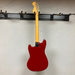 Fender Duo-Sonic II Dakota Red 1966 Vintage electric guitar on display hook, showing minor blemishes and heavy finish checking.