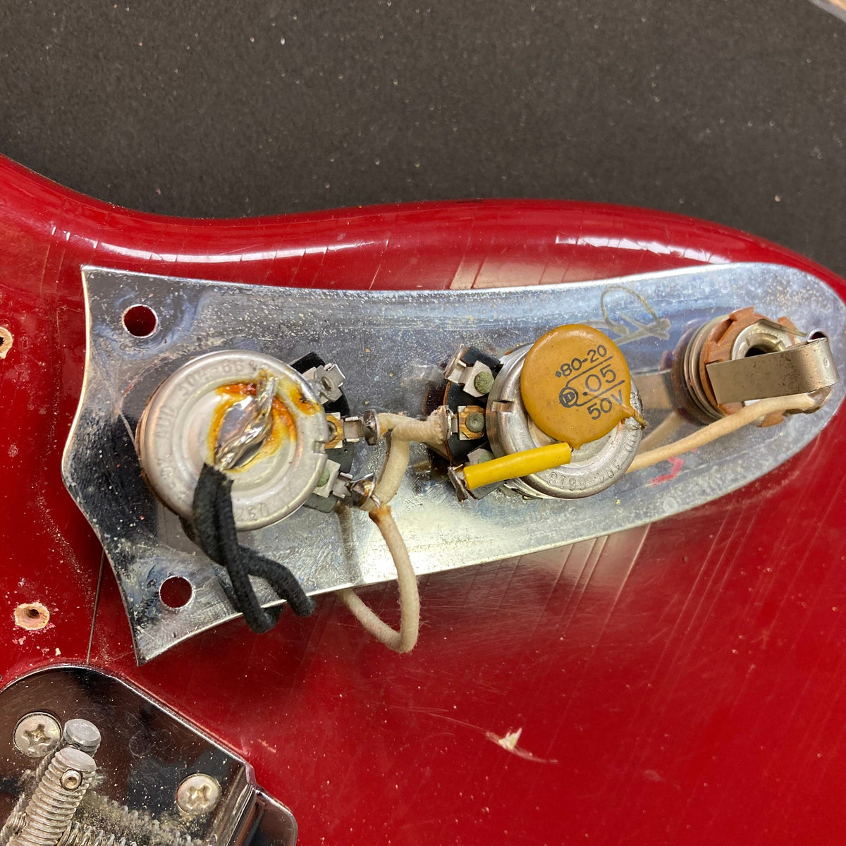 Fender Duo-Sonic II Dakota Red 1966 Vintage guitar close-up, showing minor blemishes, dual-pickups, and a shorter 24 scale length.