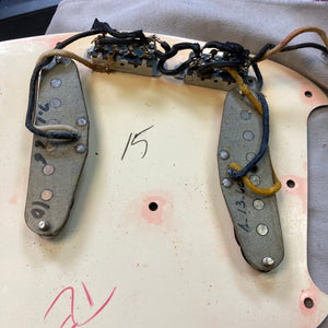 Close-up of a Fender Duo-Sonic II Dakota Red 1966 Vintage guitar showing the body, dual pickups, and minor blemishes.