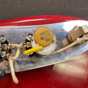 Close-up of a Fender Duo-Sonic II 1966 guitar with visible minor blemishes and heavy finish checking.