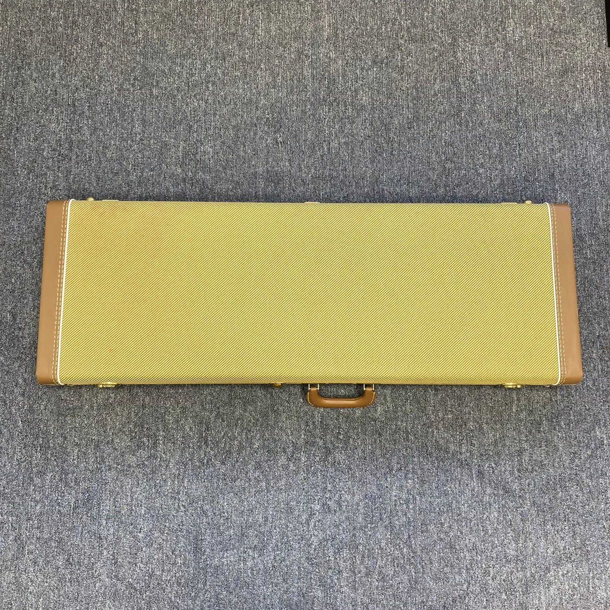 Fender Eric Clapton Artist Series Stratocaster USA 2001 with original case, placed on the floor, showcasing its barely played, pristine condition.