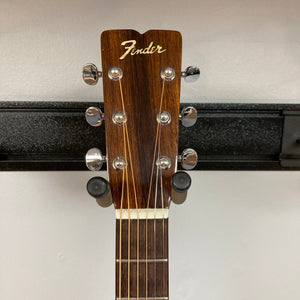 Close-up of the Fender F-35 1972-1981 guitar headstock displaying tuning pegs and strings.