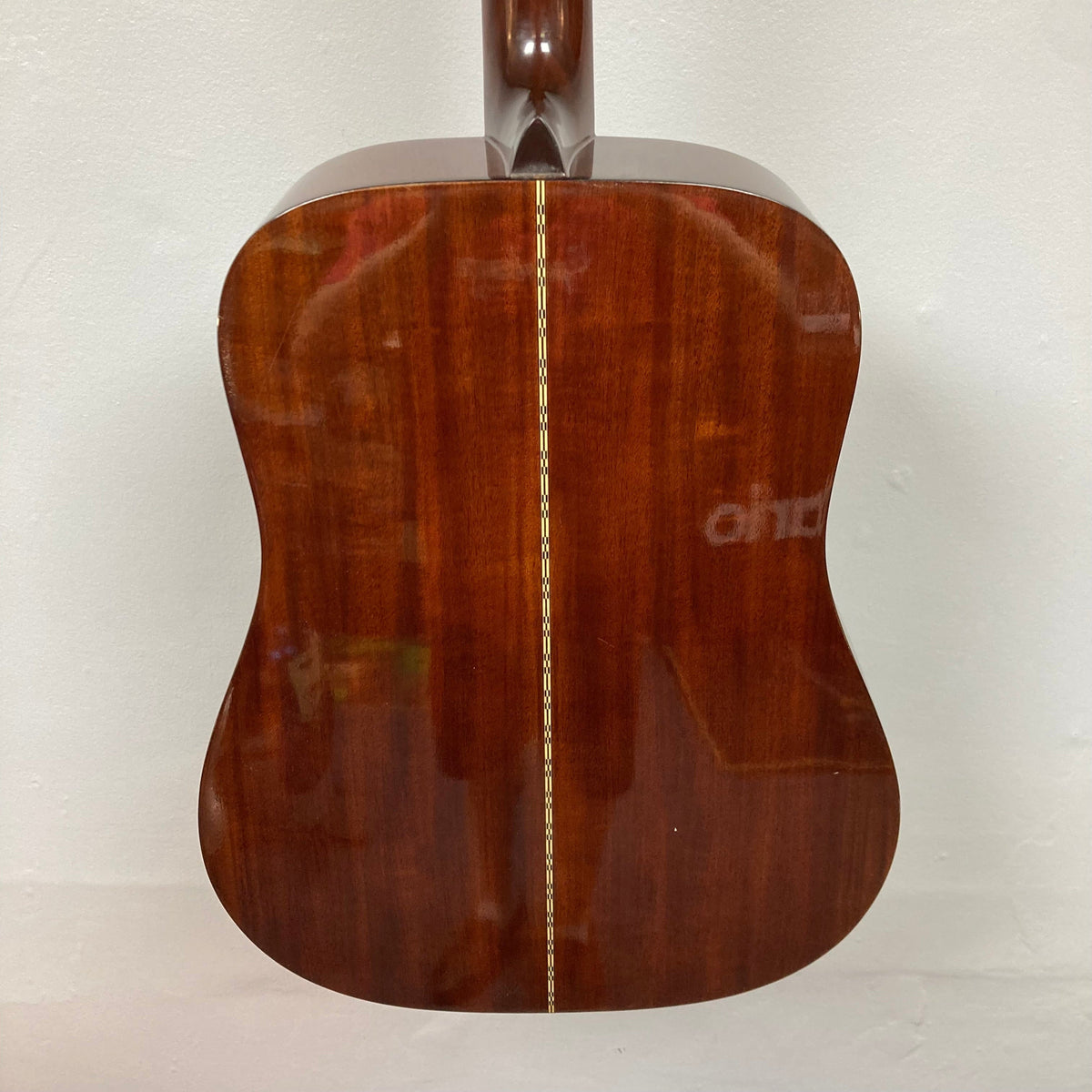 Close-up of Fender F-35 guitar (1972-1981) showcasing its Spruce top and Obankole back, highlighting its vintage craftsmanship and unique tonal character.