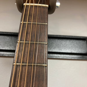 Close-up of a Fender F-35 1972-1981 guitar, highlighting its strings and neck, showcasing its vintage craftsmanship.