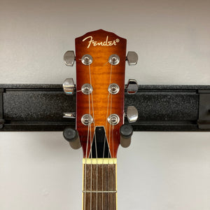 Fender FR-50CE Resonator Sunburst Used, showcasing its vintage design and resonator cone, mounted on a wall.