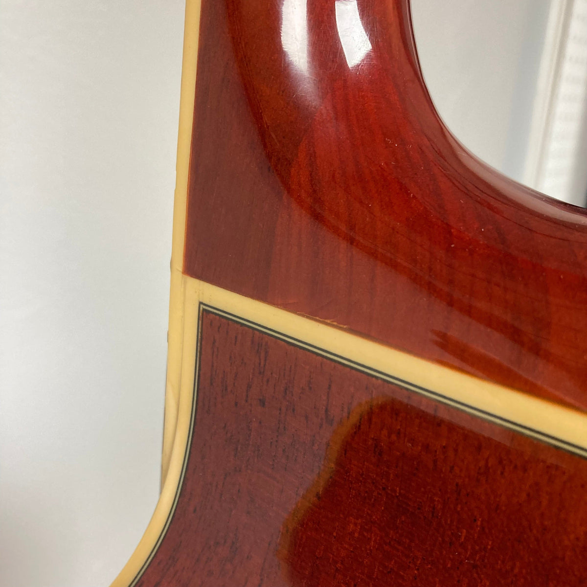 Fender FR-50CE Resonator guitar close-up showing its mahogany body and signature F-hole design.