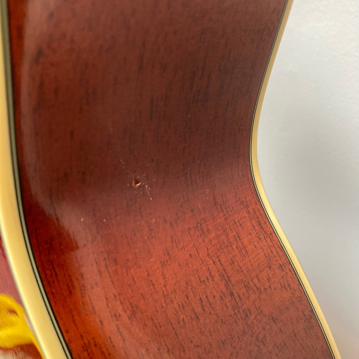 Close-up of a used Fender FR-50CE Resonator, highlighting its mahogany body and resonator cone for blues and slide guitar enthusiasts.