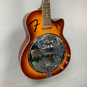 Fender FR-50CE Resonator Sunburst Used, featuring a circular mirror and silver rim, with a close-up view of the neck and body.