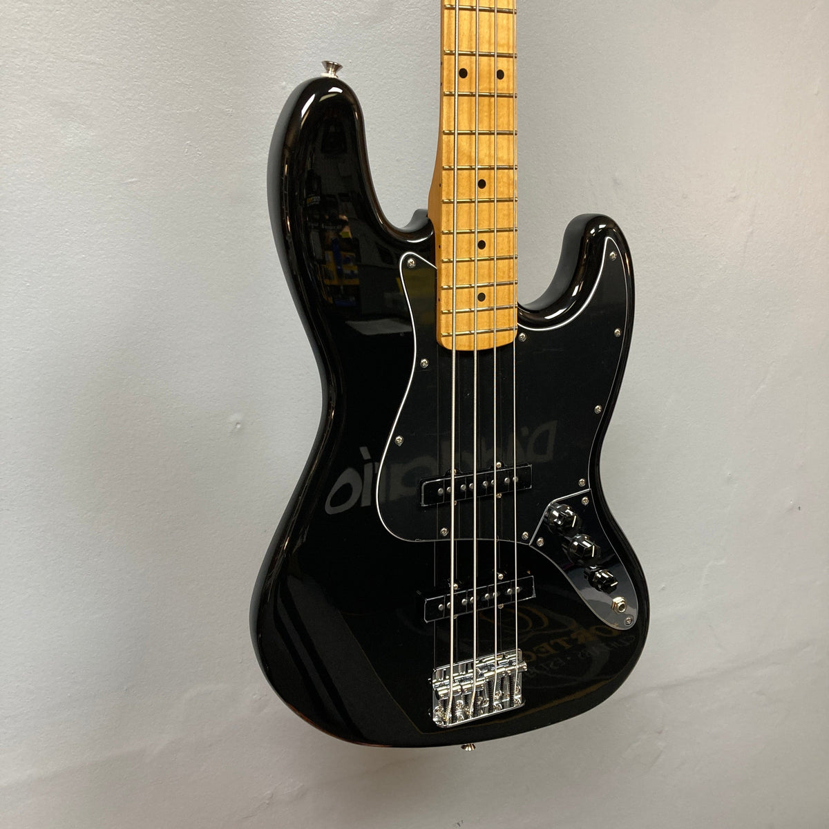 Fender Player II Jazz Bass Black Refurb on display, showcasing its contoured alder body and modern C neck profile, highlighting its classic and contemporary features.