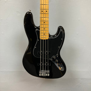 Fender Player II Jazz Bass Black Refurb with tan neck, showcasing strings, bridge, and neck close-up, highlighting its classic Fender design and craftsmanship.