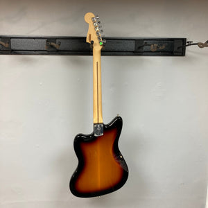Fender Player Jazzmaster 3-Tone Sunburst Refurb w/Gigbag, mounted on a wall, showcasing its classic design and solid construction.