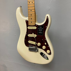 Fender Player Plus Stratocaster Olympic Pearl w/Gigbag Refurb, showcasing a sleek white and red electric guitar with a modern design and high-quality features.