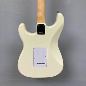 Back view of a Fender Standard Stratocaster Olympic White Refurb guitar by Fender, showing its maple neck, metal neck plate, and rectangular plastic electronics cover.