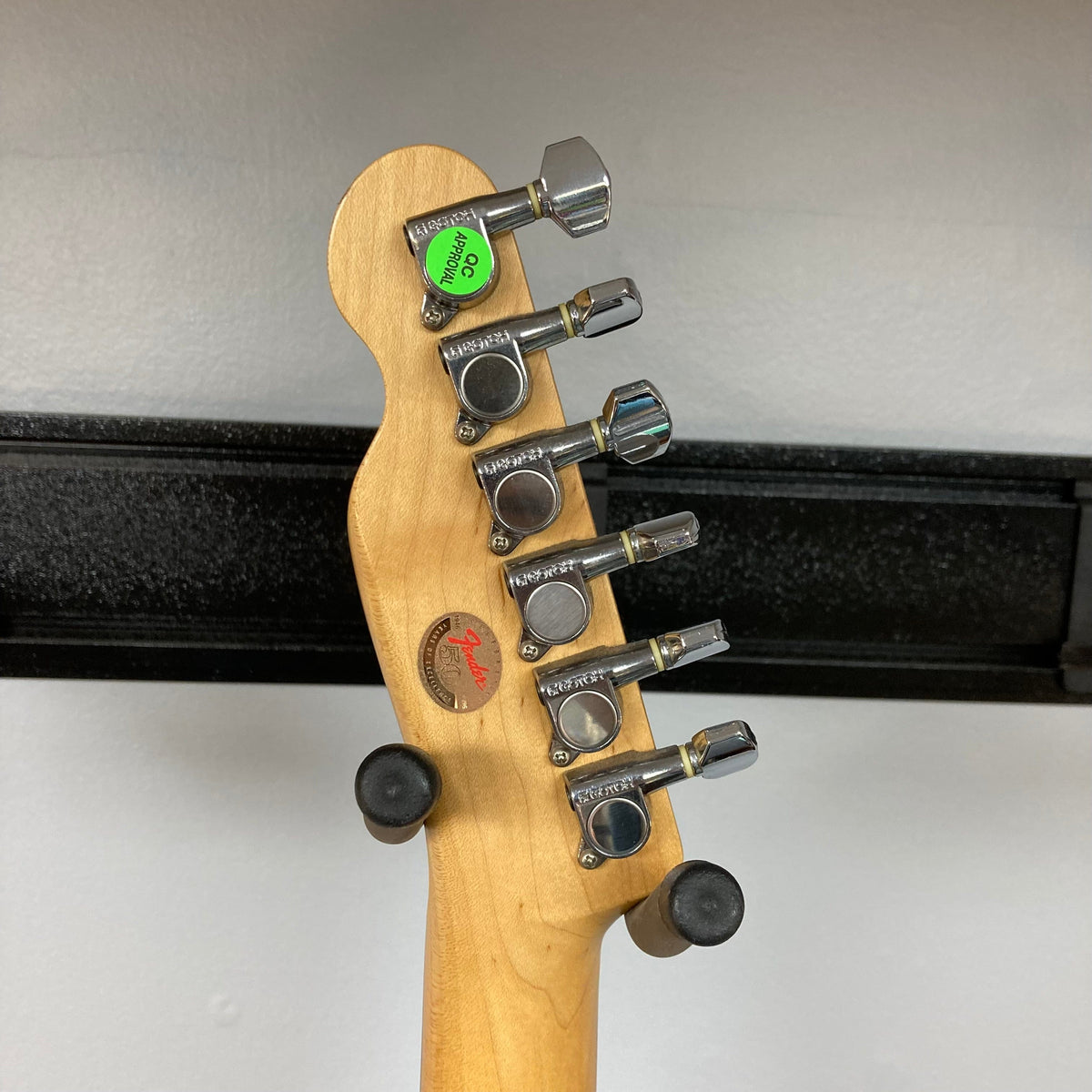 Close-up of a Fender Telecaster TLAC MIJ Acoustic/Electric Hybrid guitar, showcasing its detailed craftsmanship and vintage appeal.