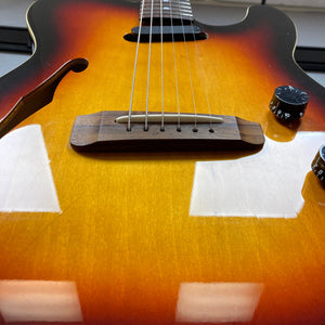 Fender Telecaster TLAC MIJ Acoustic/Electric Hybrid 1993-1997, detailed close-up of guitar strings and body, showcasing its solid construction and advanced electronics.