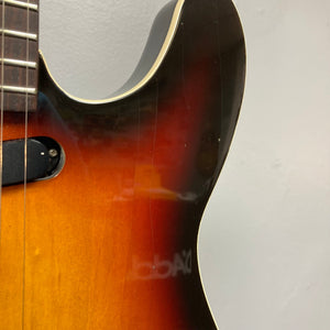 Close-up of the Fender Telecaster TLAC MIJ Acoustic/Electric Hybrid 1993-1997, showcasing its solid body and intricate string arrangement.