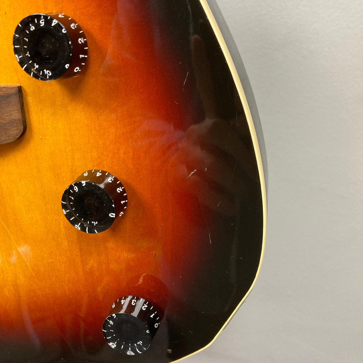 Fender Telecaster TLAC MIJ Acoustic/Electric Hybrid 1993-1997, close-up of body, showcasing the guitar's craftsmanship and built-in dial for advanced electronic controls.