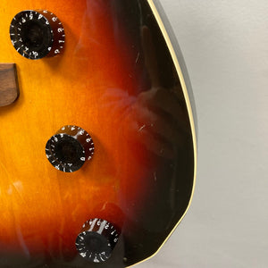 Fender Telecaster TLAC MIJ Acoustic/Electric Hybrid 1993-1997, close-up of body, showcasing the guitar's craftsmanship and built-in dial for advanced electronic controls.