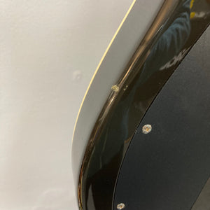 Close-up of a Fender Telecaster TLAC MIJ Acoustic/Electric Hybrid guitar, highlighting its solid body and advanced pickup system.