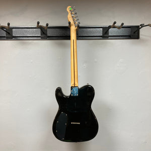 Fender Telecaster TLAC MIJ Acoustic/Electric Hybrid 1993-1997, black electric guitar with a wood neck, silver and blue accents, displayed on a wall.