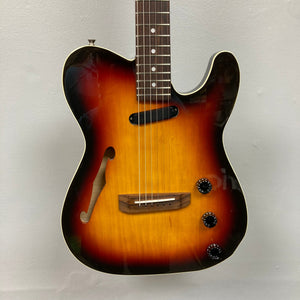Fender Telecaster TLAC MIJ Acoustic/Electric Hybrid 1993-1997 on display, showcasing its solid body, worn finish, and advanced pickup system.