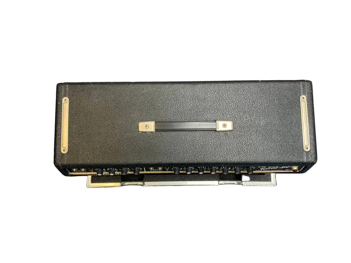 A 1966 Fender Twin Reverb 2-Channel 85-Watt 2x12" Combo Amp by Fender, featuring top handle and front control knobs, photographed on a white background with included flight case.