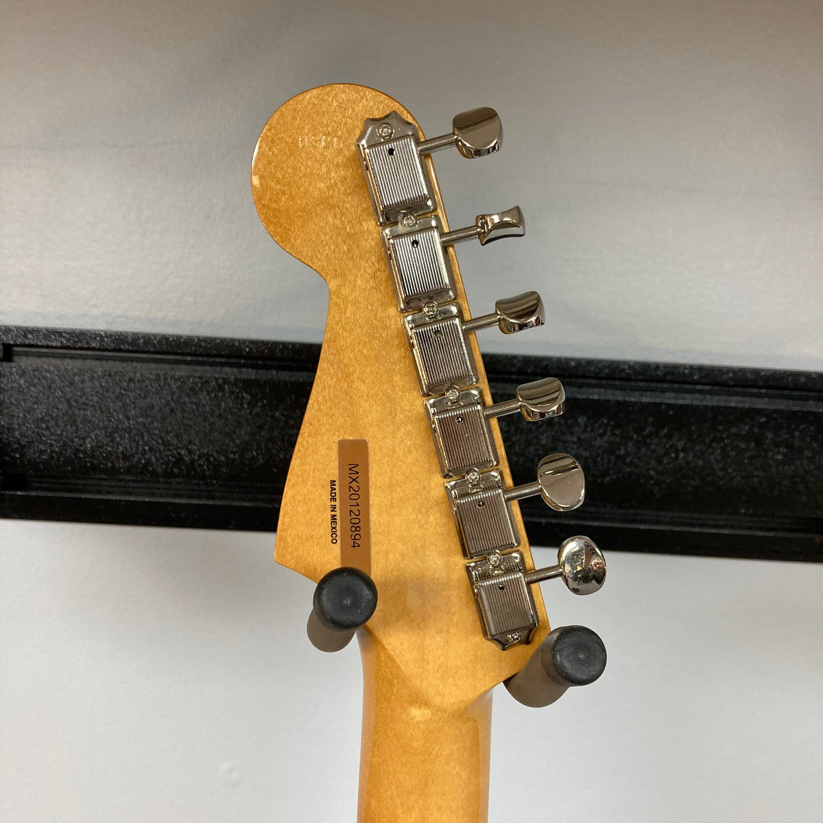 Close-up of the Fender Vintera '60s Stratocaster neck and body, highlighting vintage-style features and precision craftsmanship.