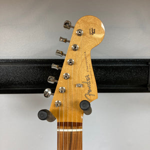 Fender Vintera '60s Stratocaster 3-Tone Sunburst Refurb with visible guitar neck, pegs, and pickups. Some minor finish blemishes and small ding on edge.