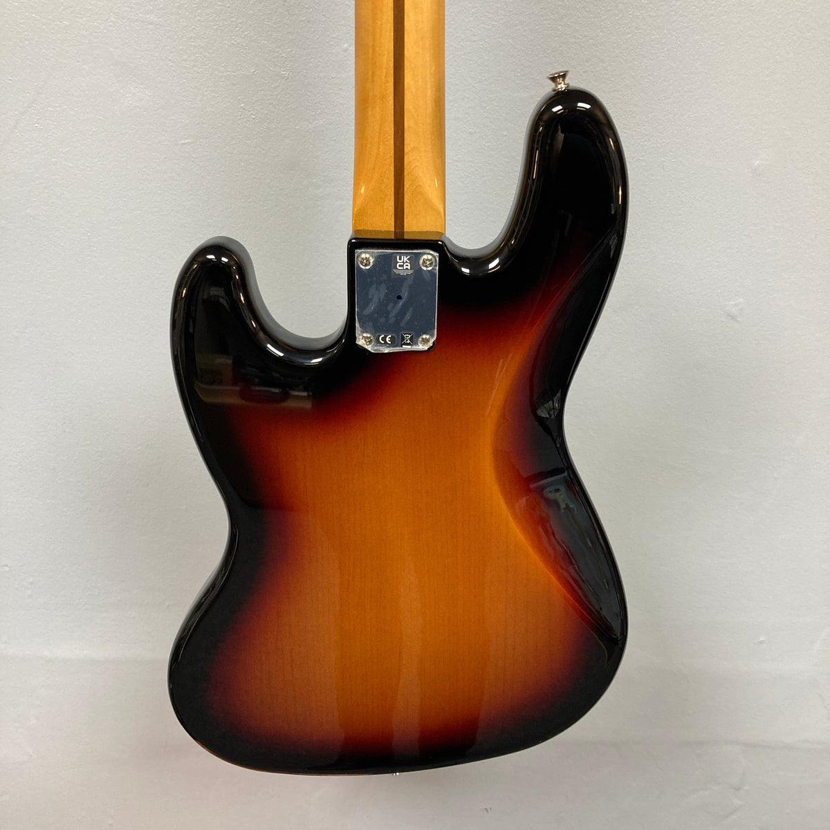 Fender Vintera '70s Jazz Bass featuring vintage-style pickups and a '70s C-shaped neck, shown in close-up detail with included gig bag.
