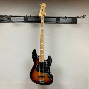 Fender Vintera '70s Jazz Bass on hook, showcasing its vintage-style neck and pickups for classic tone. Includes gig bag, set up for optimal playability.