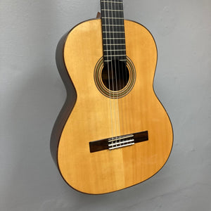 Giambattista G8 Natural Used guitar, showcasing detailed craftsmanship with visible strings and tuning hardware, highlighting its classical design and premium build quality.