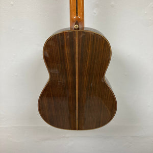 Close-up of a Giambattista G8 Natural Used classical guitar, highlighting its detailed craftsmanship and high-gloss finish, showcasing its quality construction.