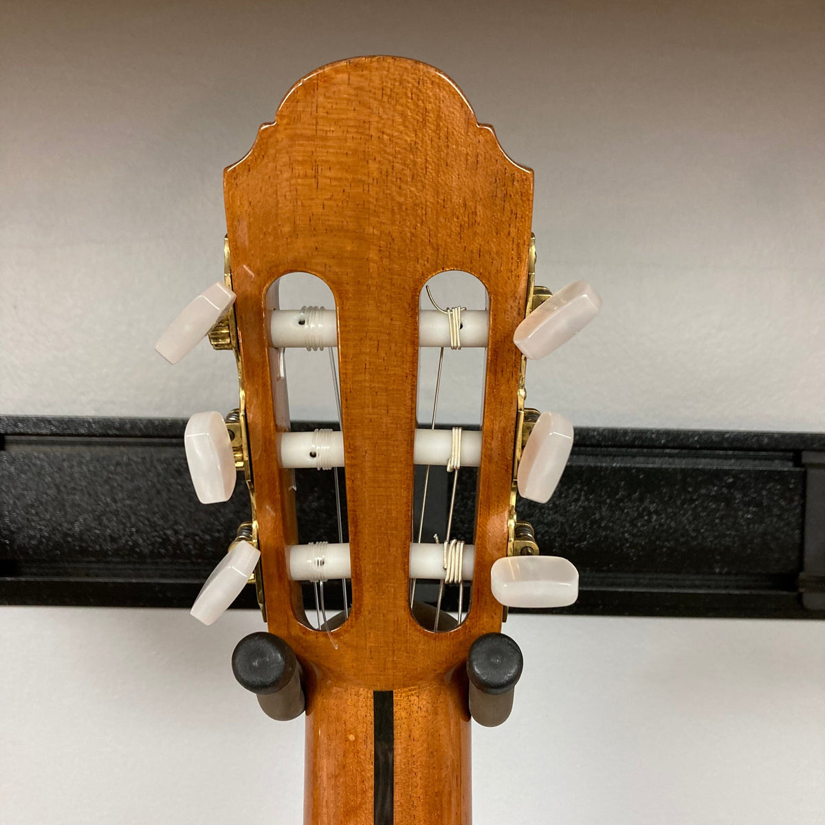 Giambattista G8 Natural Used guitar displaying its headstock and back, crafted by Jean-Baptiste Castelluccia, highlighting traditional craftsmanship with precise tuning hardware.