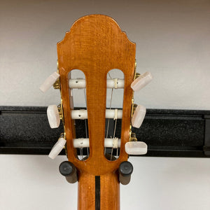 Giambattista G8 Natural Used guitar displaying its headstock and back, crafted by Jean-Baptiste Castelluccia, highlighting traditional craftsmanship with precise tuning hardware.