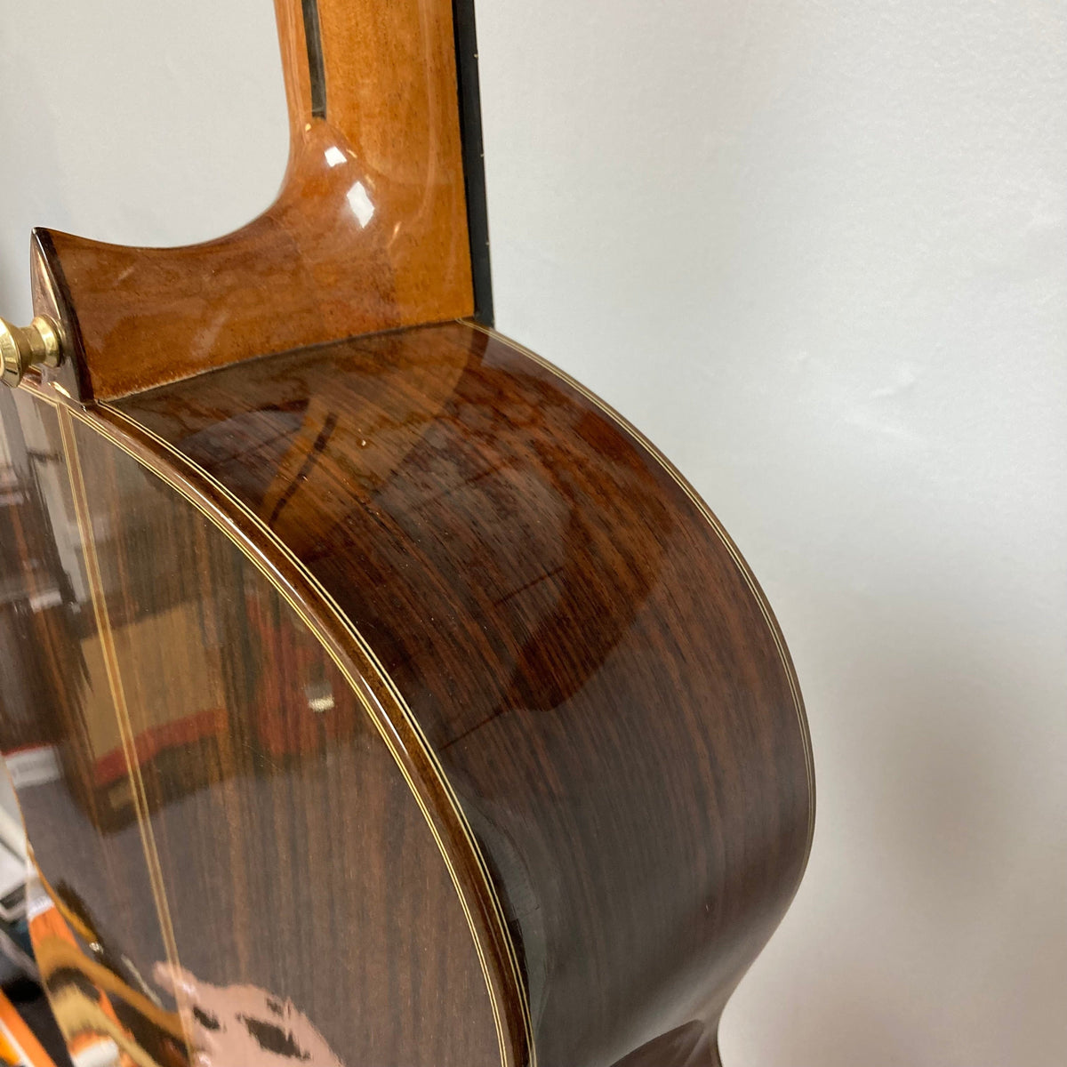 Close-up of the Giambattista G8 Classical Guitar, highlighting its detailed craftsmanship and tonewoods, by Jean-Baptiste Castelluccia.