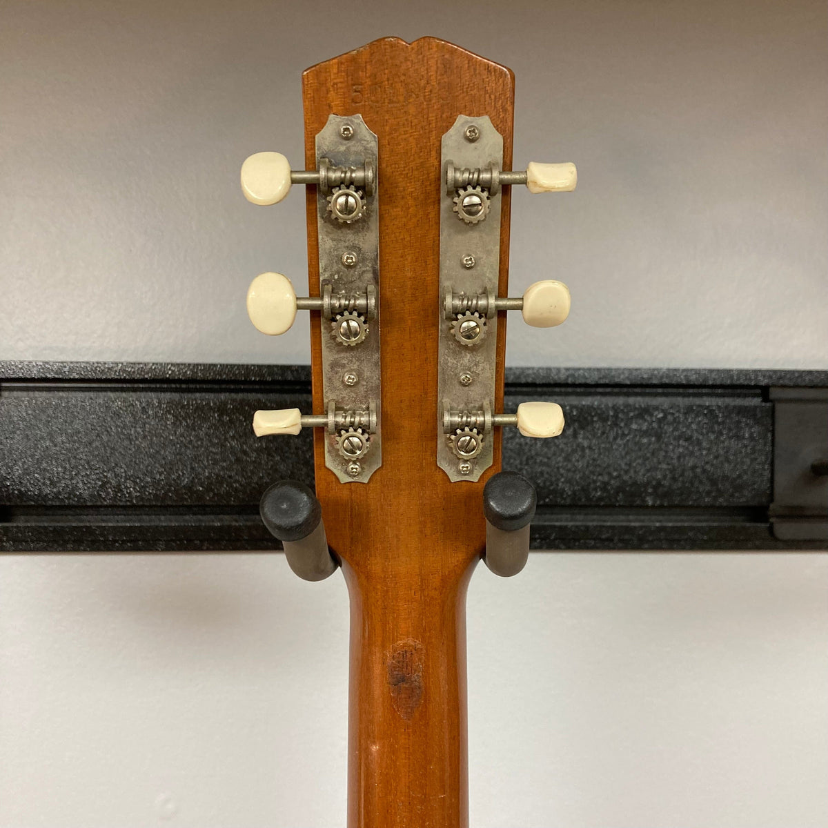 Gibson B-15 1967 - 1969 Natural w/Case showing guitar neck with white knobs and signs of wear.