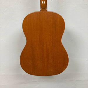 Close-up of a Gibson B-15 1967 - 1969 Natural acoustic guitar, highlighting its solid mahogany body and neck, showcasing vintage wear.