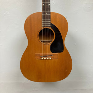 Gibson B-15 1967 - 1969 Natural w/Case, vintage acoustic guitar, close-up of strings and body, showcasing mahogany build and wear from age.